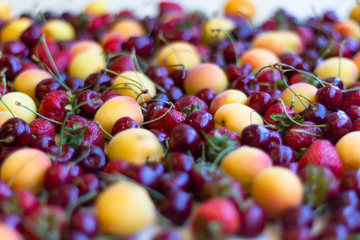 Still life, composition of fruits and berries. Juicy, ripe fruits and berries, apricots, strawberries, cherries, cherries. Berries for the desktop.