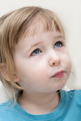 funny serious emotional white child girl face closeup