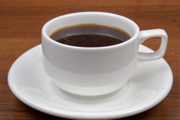 Cup of coffee on a wooden table