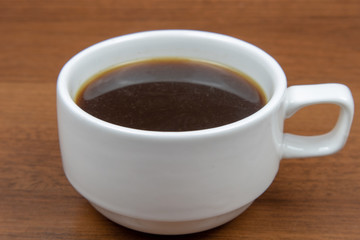 Cup of coffee on a wooden table
