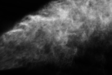 A stream of water and a cloud of drops