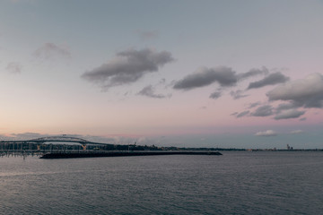 Evening view of Auckland bridge and calm water of the harbour