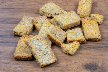 Salty crackers on a wooden table close-up