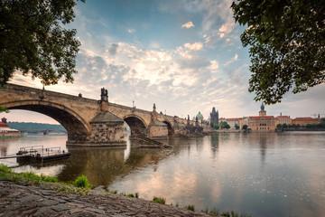 Obraz premium Beautiful morning view with Vltava river and Charles bridge in Prague, Czech Repiblic