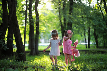 Fototapeta premium Mom with two daughters twins