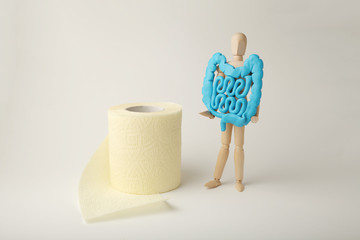 Healthy intestines in hands of human figure. Digestive problems, colic, dysbacteriosis. Toilet...