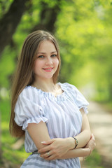 Fototapeta premium A girl in a spring green park