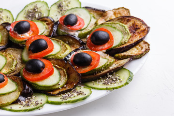 Baked eggplant and zucchini with fresh tomatoes,onions and olives