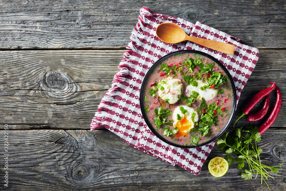 Wall mural bean soup with poached eggs in a bowl