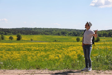 Young man travels with a backpack
