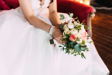 Obraz na płótnie Canvas Close-up of the bride holding a bouquet. Wedding bouquet. Bride's bouquet
