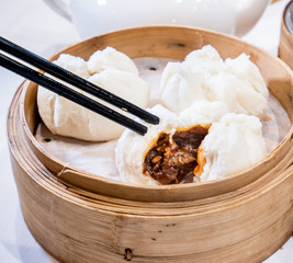 Delicious dim sum, famous cantonese food in asia - Fresh and hot Cha Siu Bao, BBQ pork bun in...