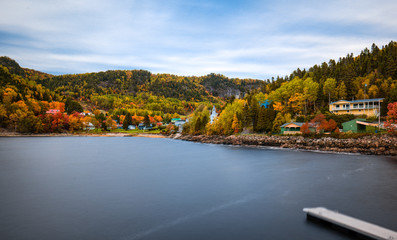 Lake view of the Sainte Rose du Nord village in Quebec. Long exposure