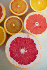 Obraz na płótnie Canvas pink grapefruit and orange on white background