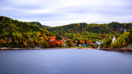 Lake view of the Sainte Rose du Nord village in Quebec. Long exposure