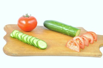 cucumber and tomato slices on a board