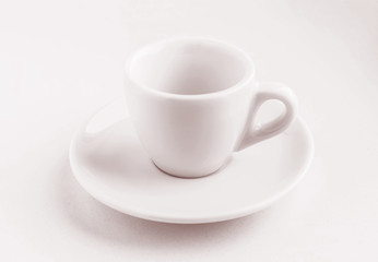 tinted in pink white coffee cup and saucer, empty coffee-free coffee cup, front view from above, or black coffee, on a white background