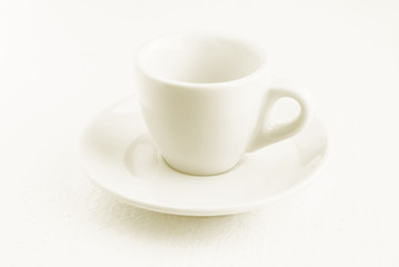 white coffee cup and saucer, empty coffee-free coffee cup, front view from above, or black coffee, on a white background