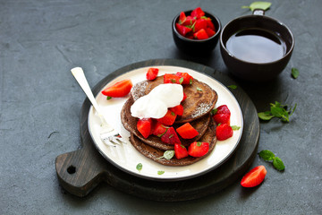 Chocolate pancakes with berries.