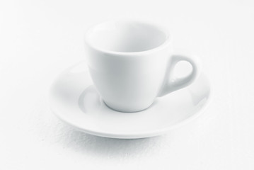white coffee cup and saucer, empty coffee-free coffee cup, front view from above, or black coffee, on a white background