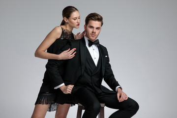 Serious young man being comforted by his girlfriend