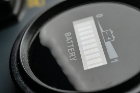 Battery level gauge on control panel of machine closeup 
