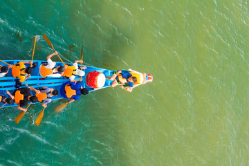 a dragon boat on the river and racing