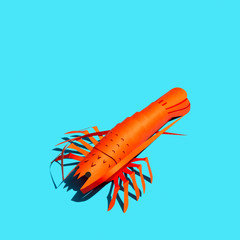 Paper lobster with shade in bright sunshine