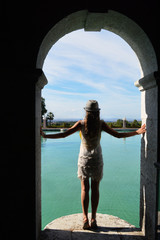 Woman looking over water