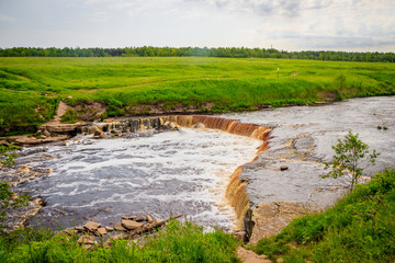 Sablinsky waterfalls. Little waterfall. The brown water of the waterfall.. Thresholds on the river....