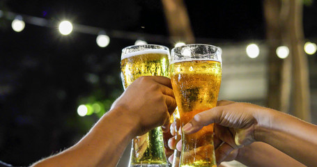 Asian group of friends having party with alcoholic beer drinks and Young people enjoying at a bar...