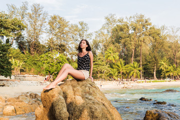 Young woman over tropical sea and beach background