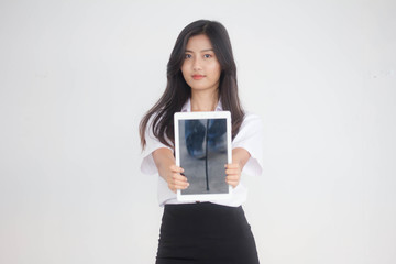 Portrait of thai adult student university uniform beautiful girl using her tablet.