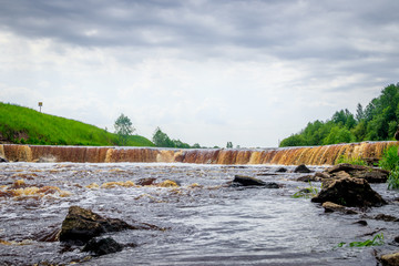 Sablinsky waterfalls. Little waterfall. The brown water of the waterfall.. Thresholds on the river....