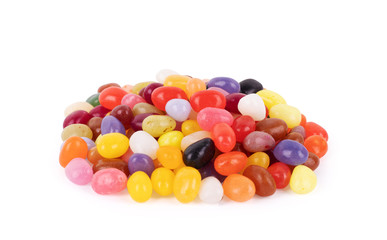 Many colored jelly beans on a white background