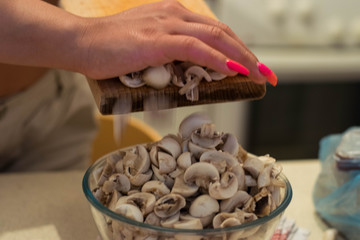 Female cutting mushrooms