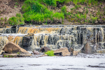 Sablinsky waterfalls. Little waterfall. The brown water of the waterfall.. Thresholds on the river....
