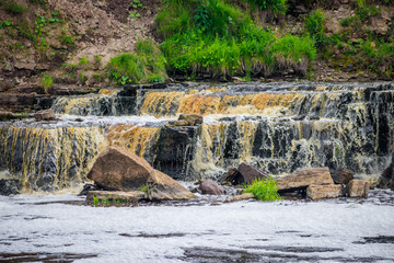 Sablinsky waterfalls. Little waterfall. The brown water of the waterfall.. Thresholds on the river....