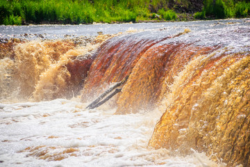 Sablinsky waterfalls. Little waterfall. The brown water of the waterfall.. Thresholds on the river....