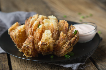 Blooming onion with yoghurt sauce