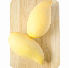 Mango juice on wooden floor, tropical fruit isolated on a white background