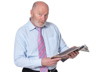 Elderly businessman with magazine isolated on white background