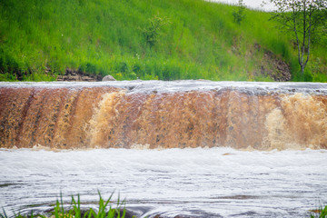 Sablinsky waterfalls. Little waterfall. The brown water of the waterfall.. Thresholds on the river....