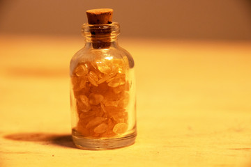 Corked bottle of citrine crystals