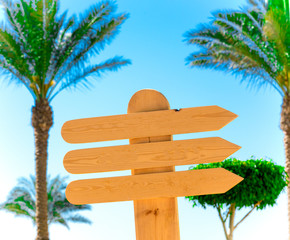Wooden signposts against the blue sky