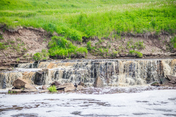Sablinsky waterfalls. Little waterfall. The brown water of the waterfall.. Thresholds on the river....