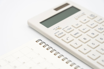 Flat lay of top view office table desk with Calendar, calculators pens and other office supplies as background Workspace and Comfortable work table concept with copy space.