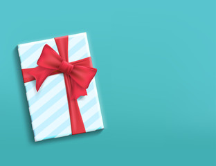 Gift box with red ribbon and bow.