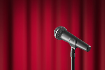 Obraz premium Black microphone with stand against red curtain. Dof effect.