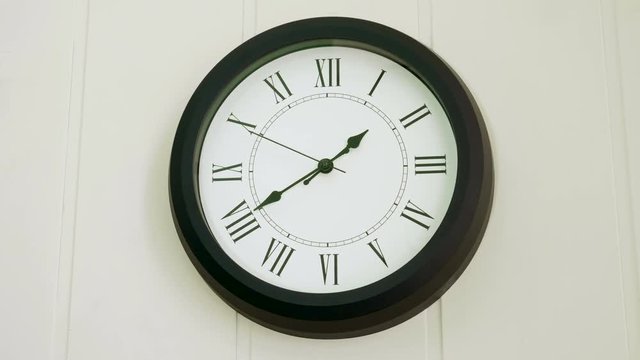 Wall clock showing what time it is. Forty one minutes past one hour p.m. 4K